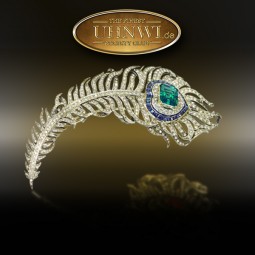 Brosche Pfauenfeder mit 7,5ct Muzo-Smaragd u. 8,90 ct Diamanten und Saphiren